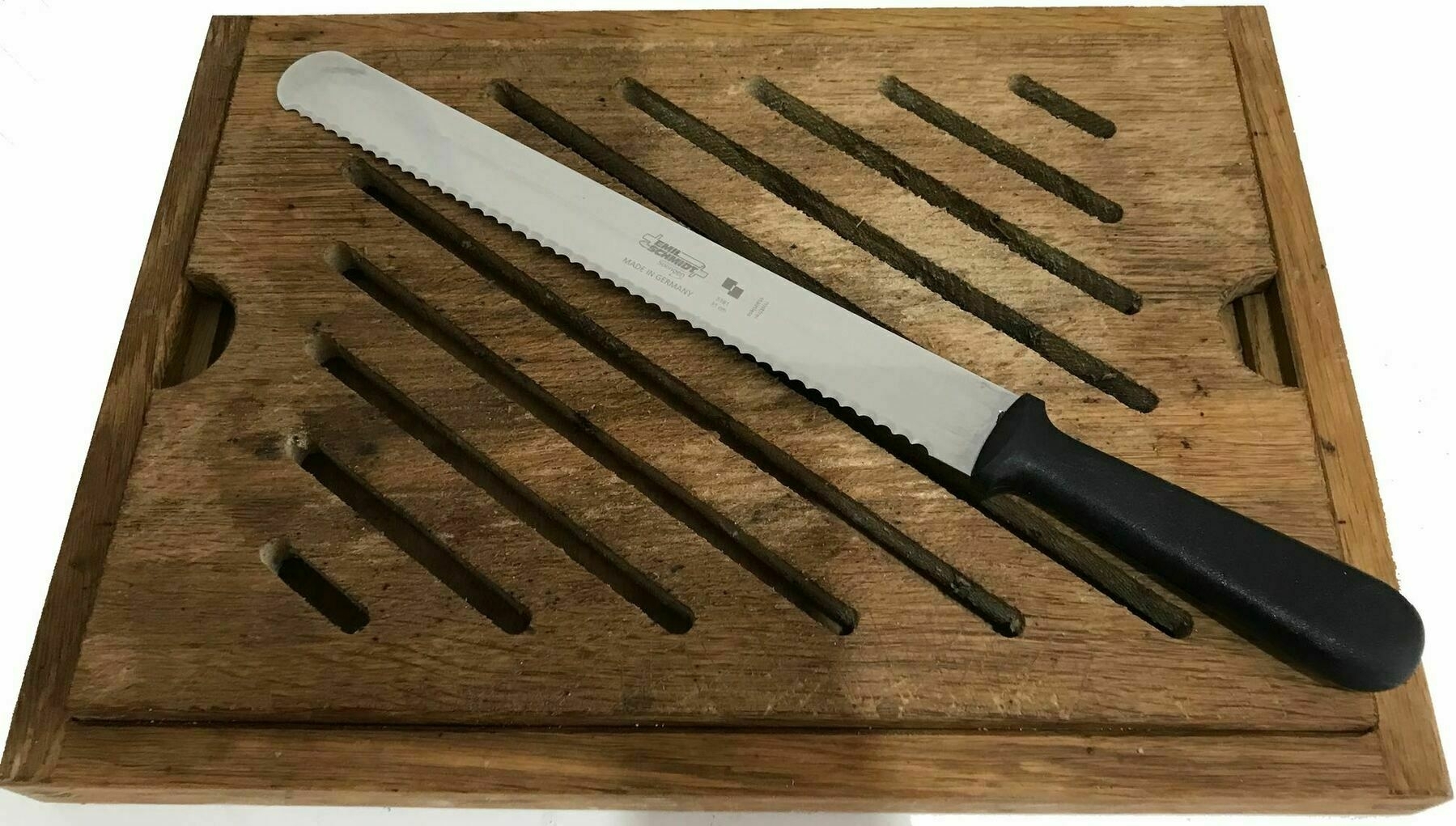 A bread knife on a bread board