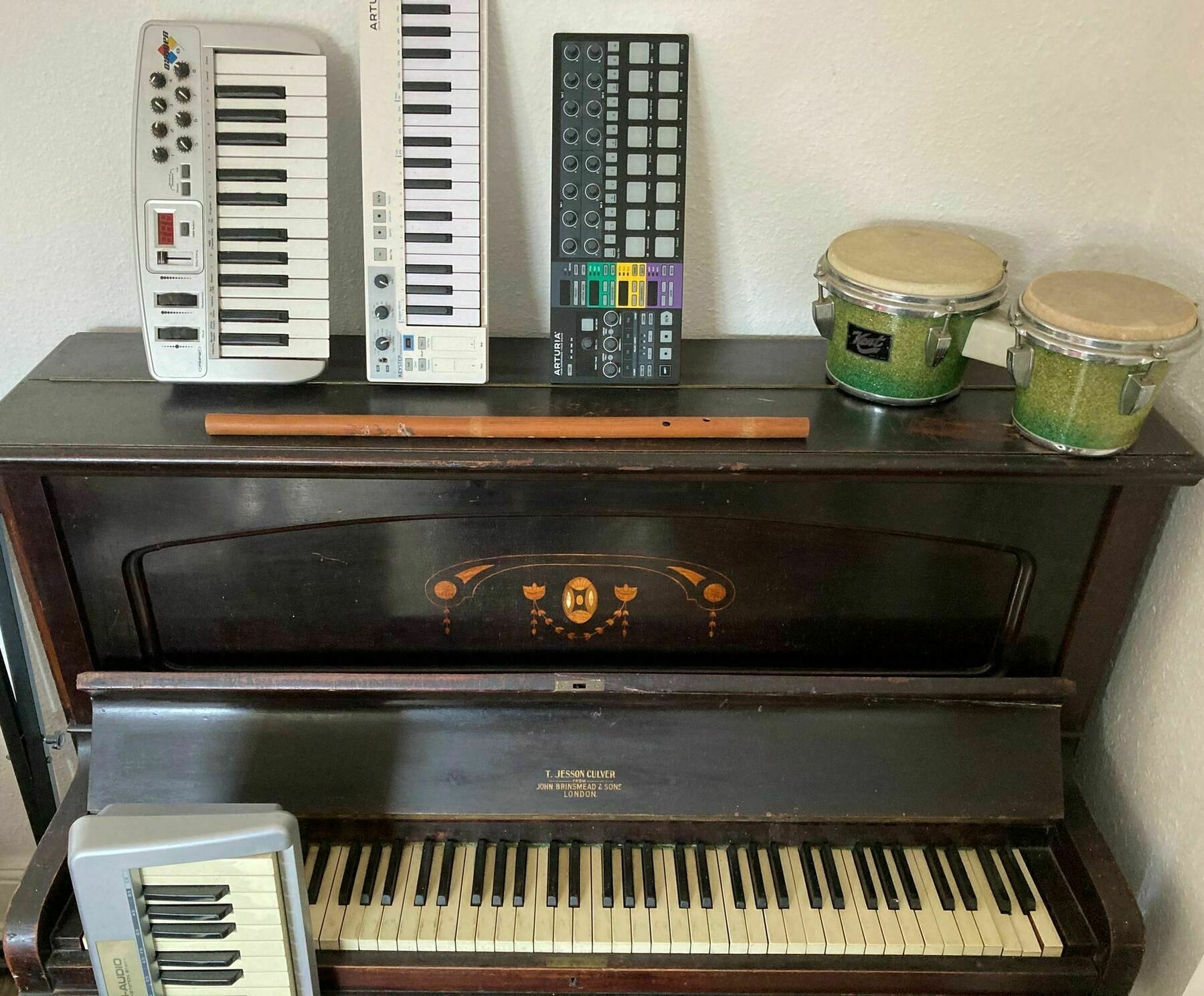 old piano with assorted instruments