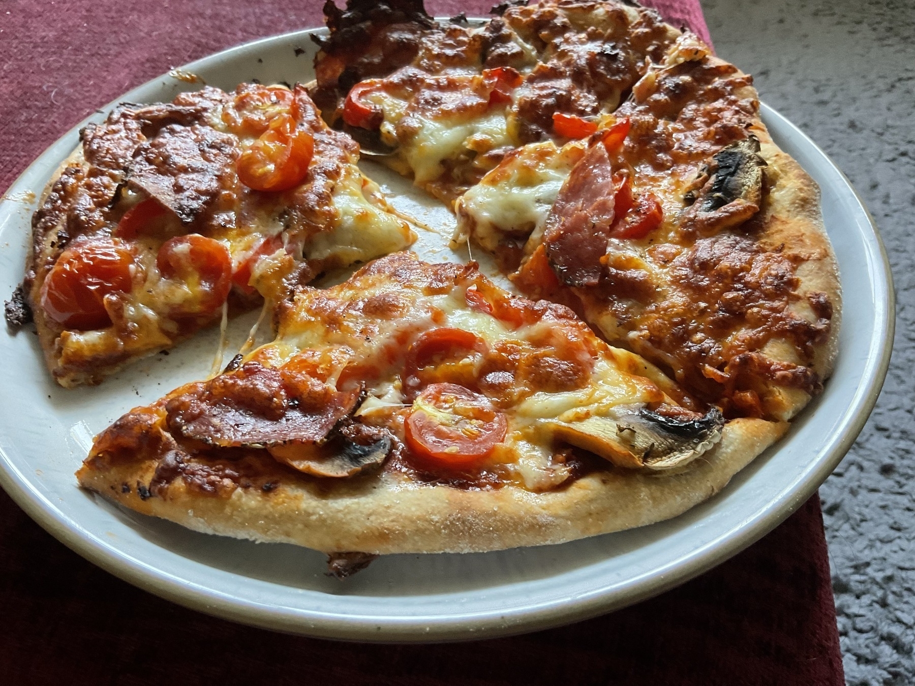 A delicouse pizza on a sourdough base.